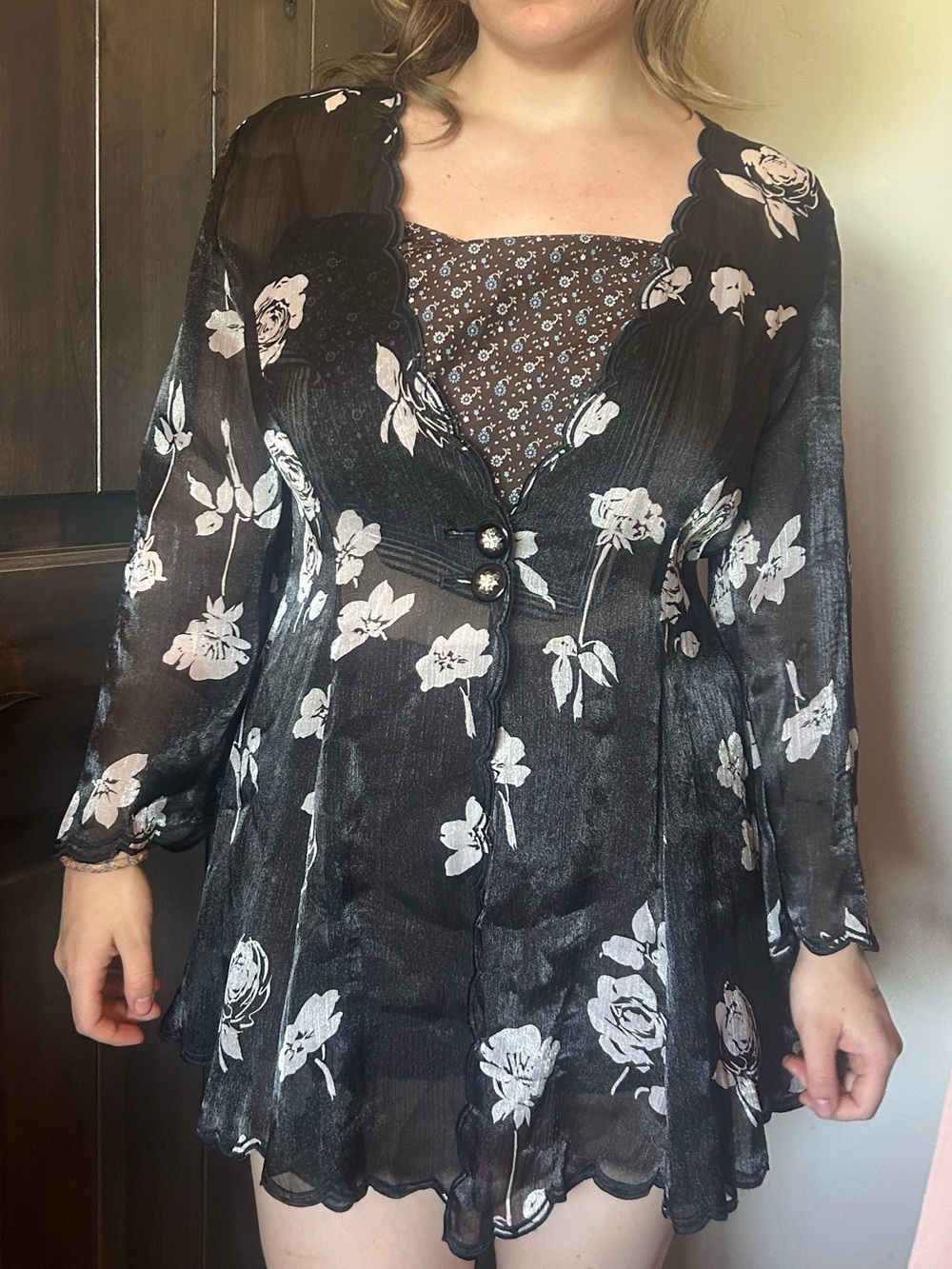 black sheer long sleeve top with white florals (about a med-large)